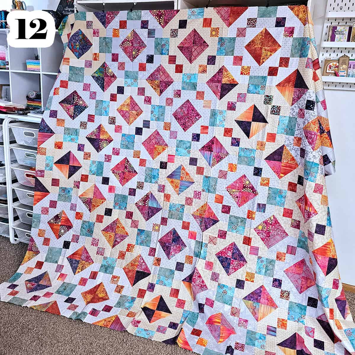 Large quilt made with fabrics from Craftsy.