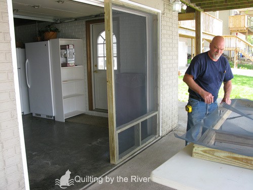 Builder Bob making screened garage door for cats
