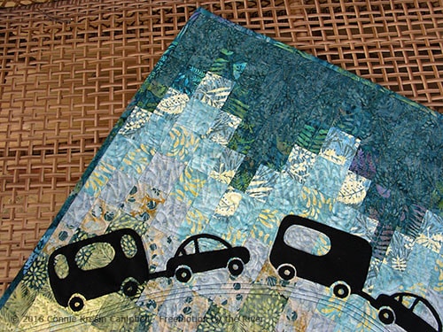 Close up of Caravan quilt made with Crystal Cove collection from Island Batik 