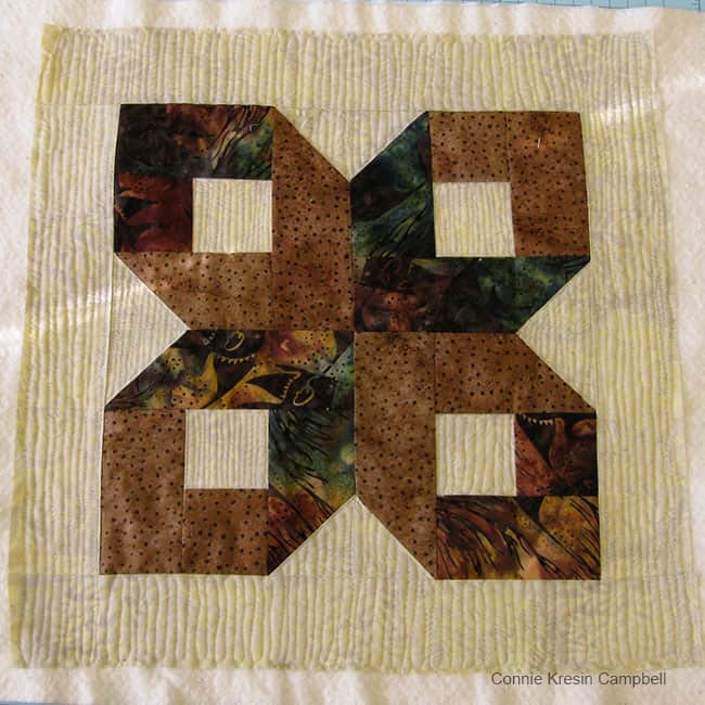 Brown Batik Box Pillow and Aurifil thread