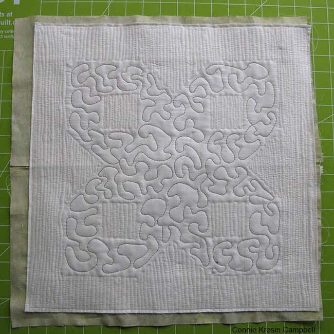 Stitch the pillow front and back together