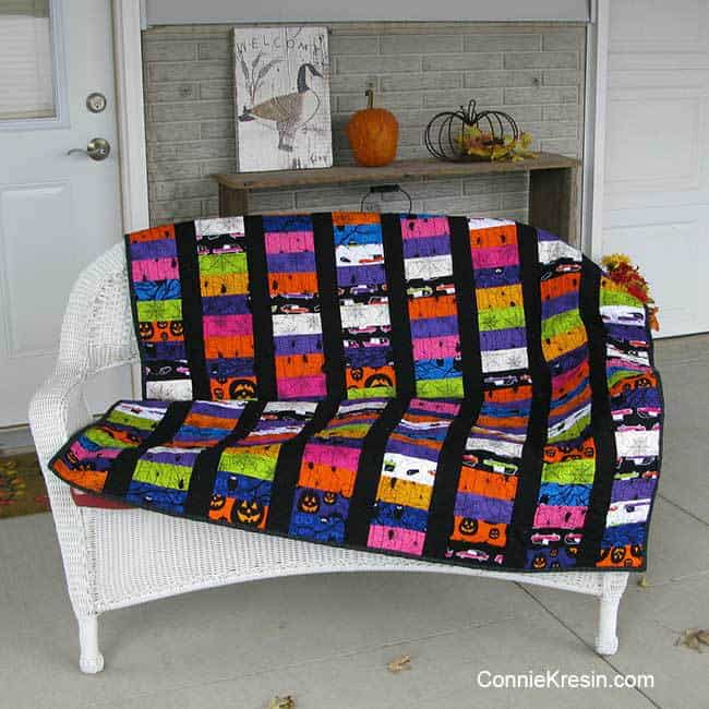 Eerie quilt for Halloween on the bench outside