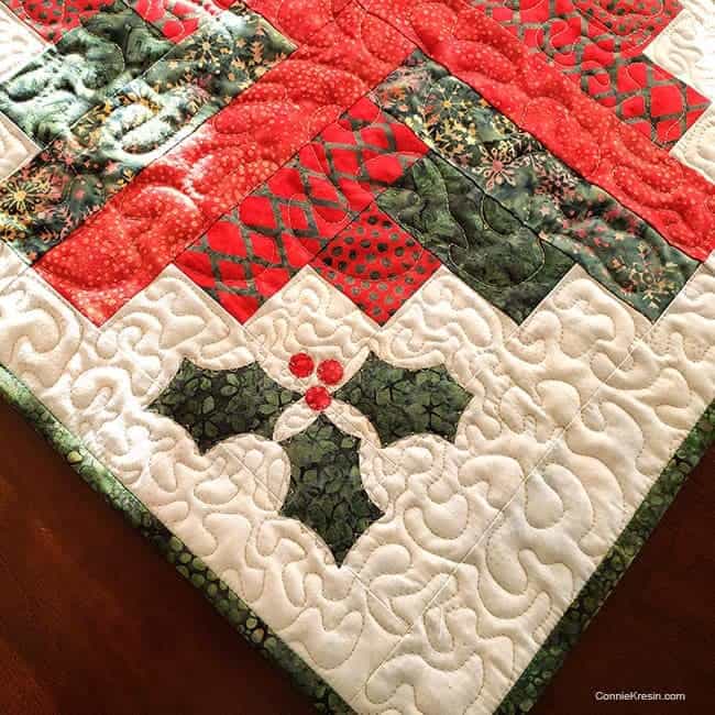 Closeup on Log Cabin quilted wall hanging