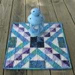 another view of the Affinity quilt block made in to a table topper on deck