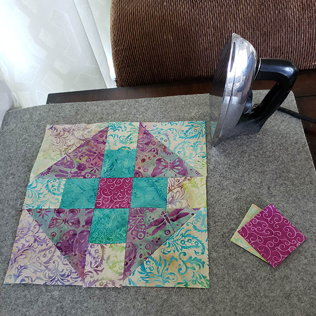Luna quilt block on wool ironing mat for Island Batik quilt