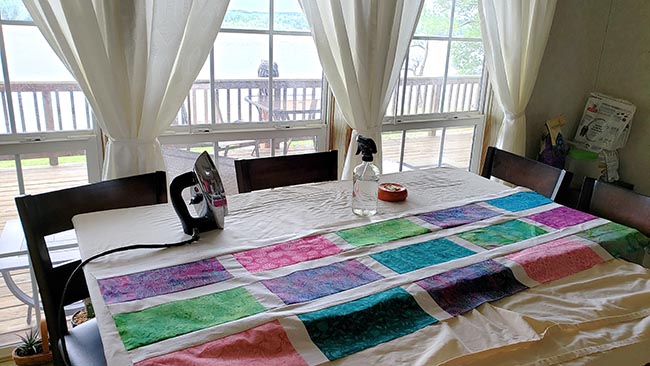 Ironing board for quilts on kitchen table