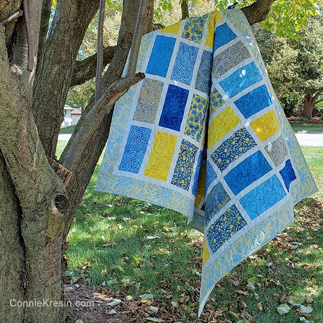 Sparkles quilt pattern in tree made with Sunny Side Up batik collection