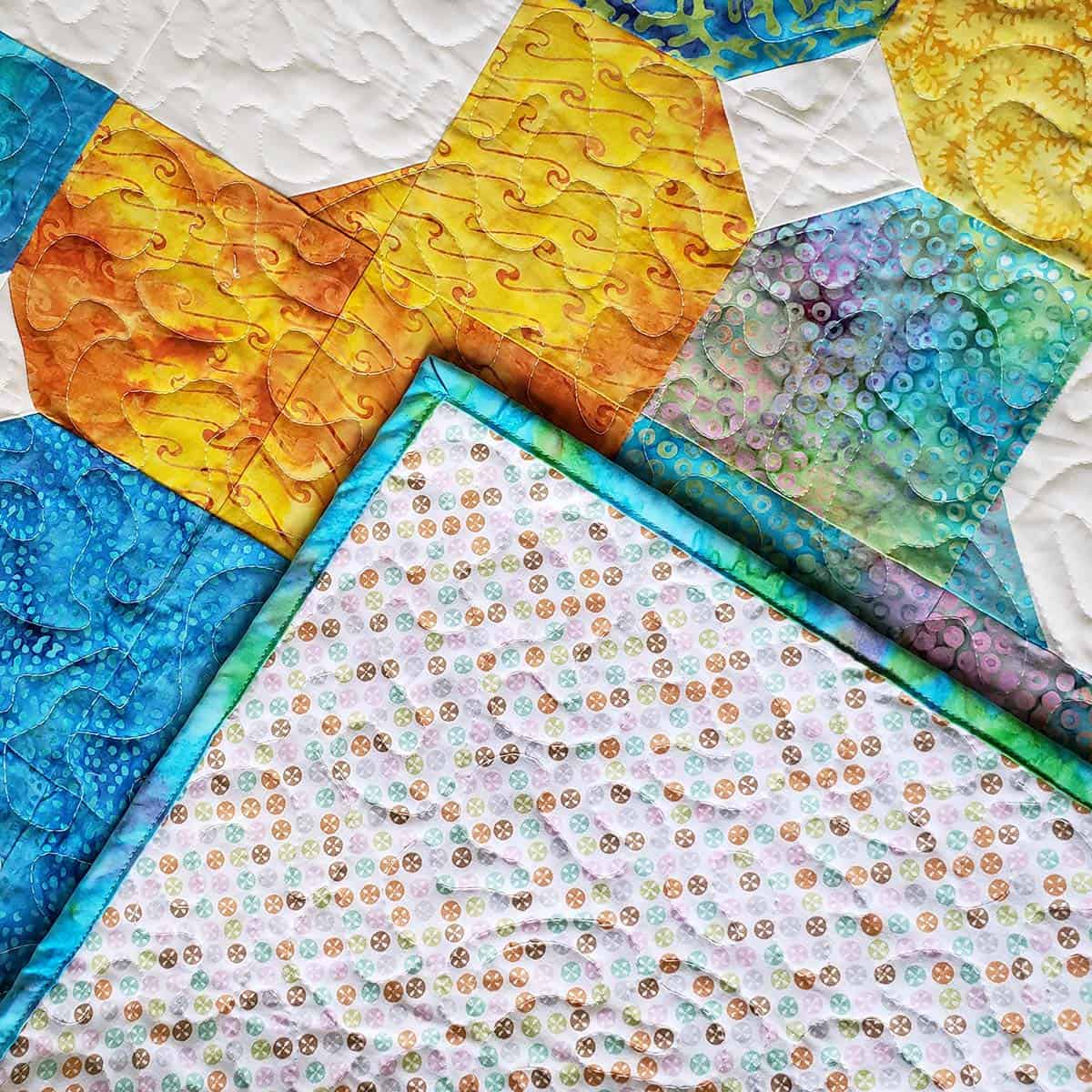 Add binding to the Morning Glory baby quilt