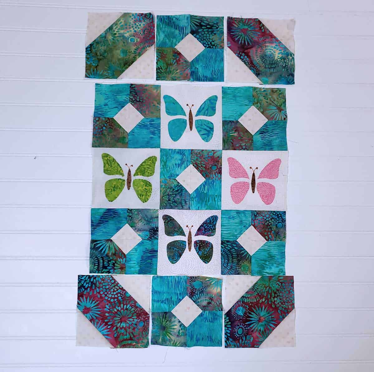 Laying out the blocks for the Butterfly Cage quilt