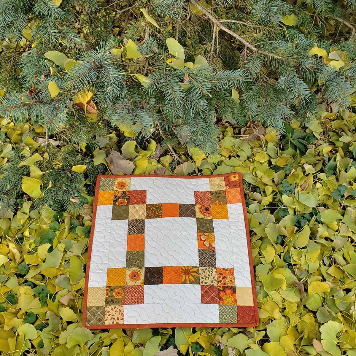 Autumn table topper laying on ginkgo leaves