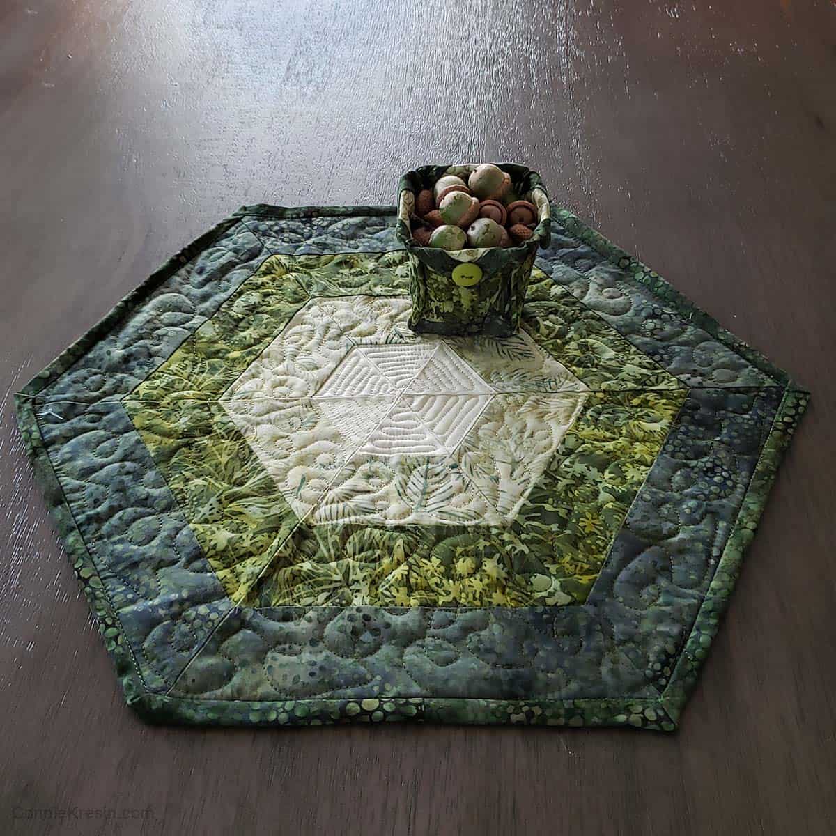 Green batik table topper and small fabric basket
