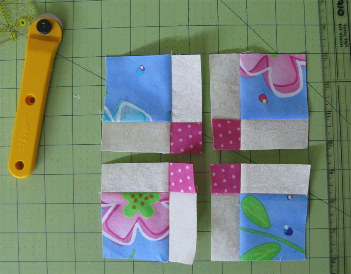 turn the quilt block and cut in half again