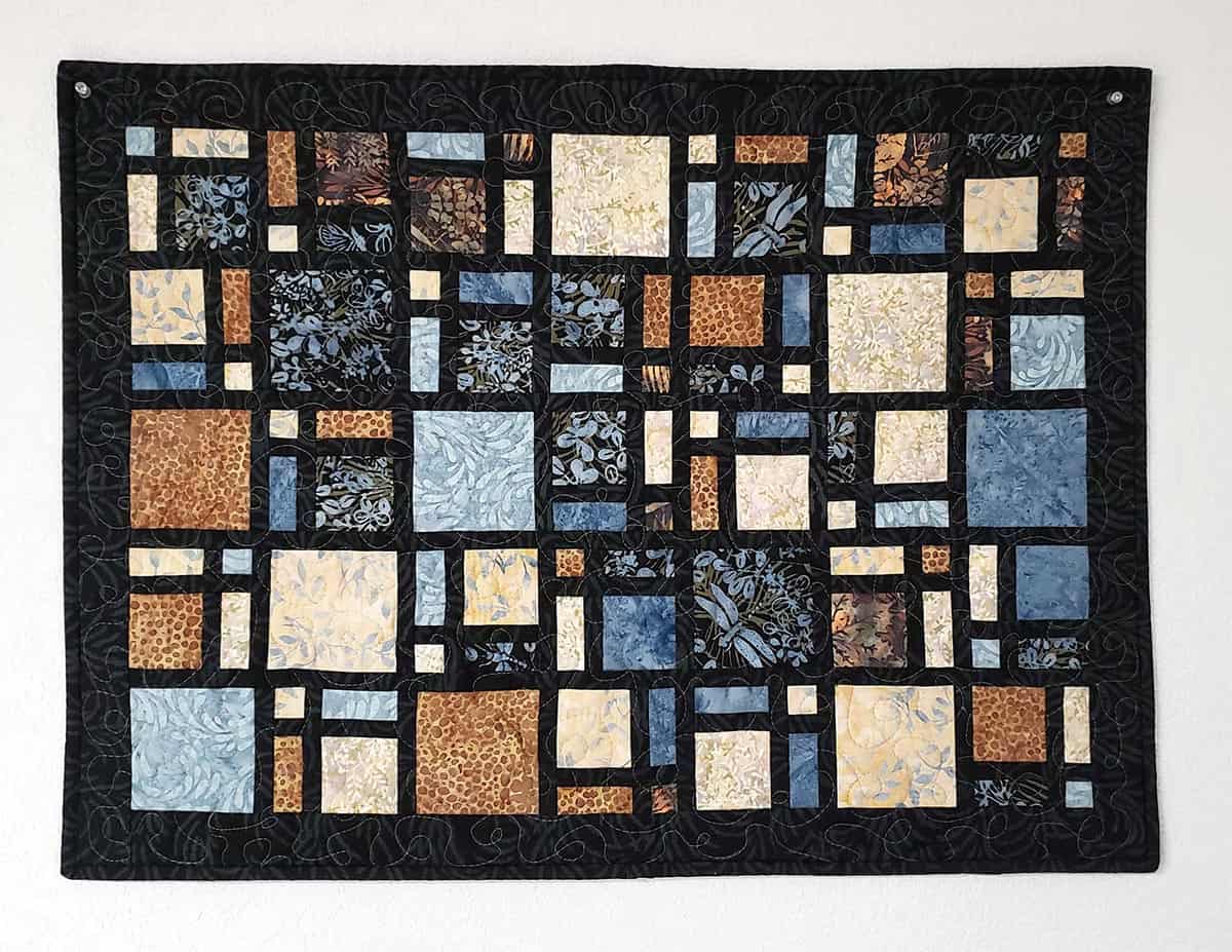 Mini Scattered quilt in browns and blue batiks
