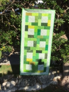 Midnight Glow Table runner in greens