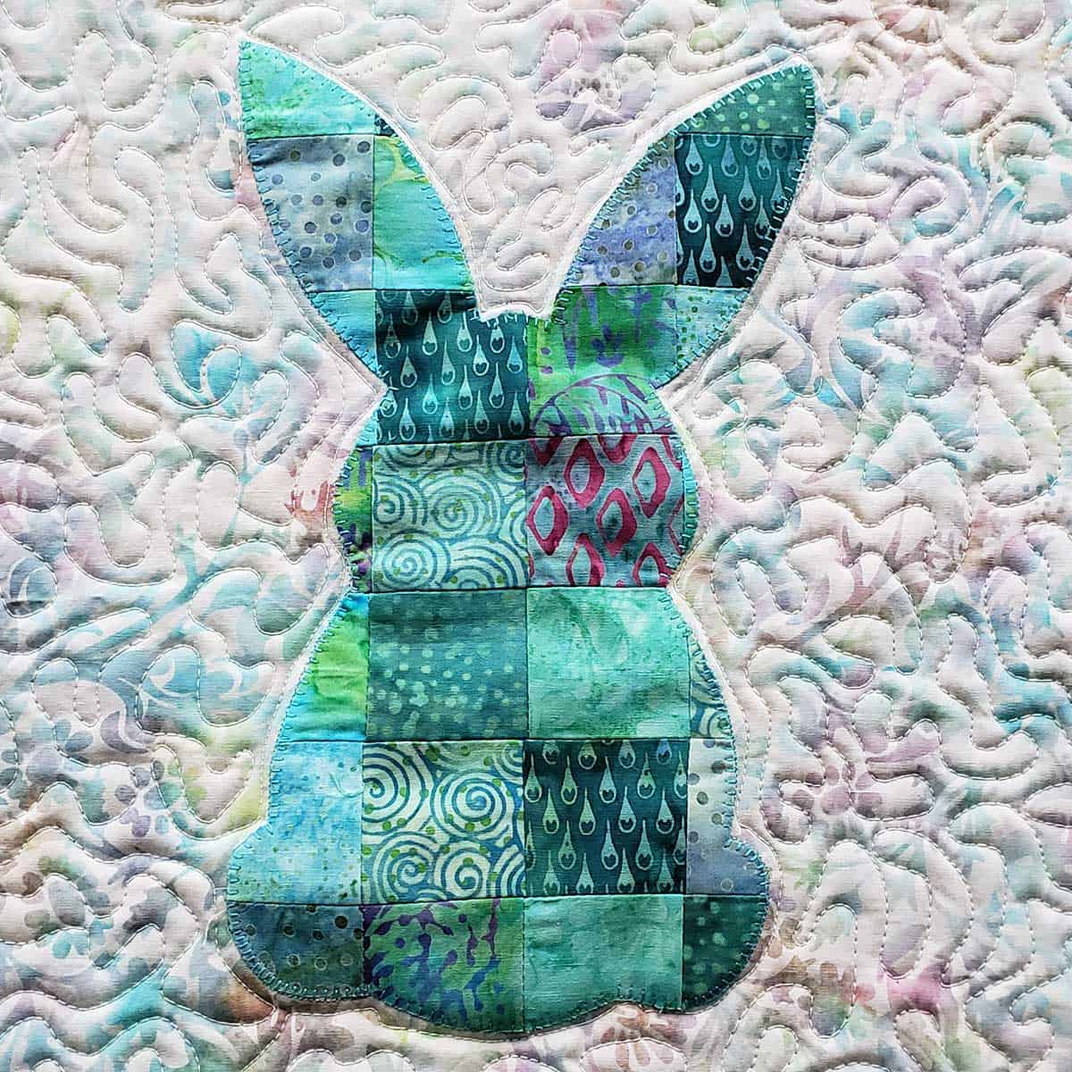 Blanket stitch around the patchwork rabbit applique