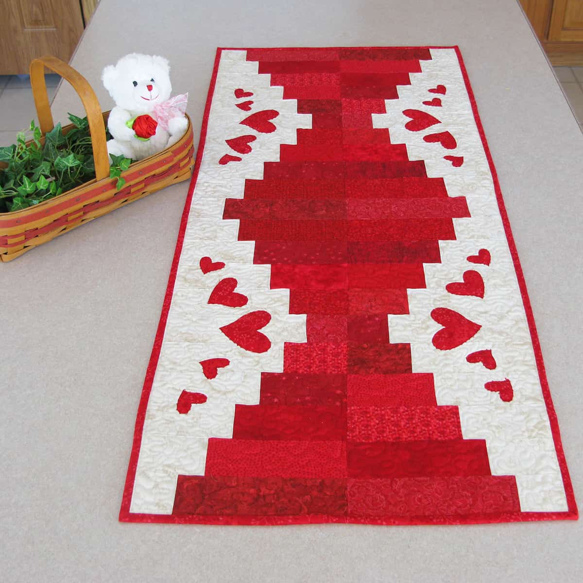 Piano Keys table runner in red and white with heart applique