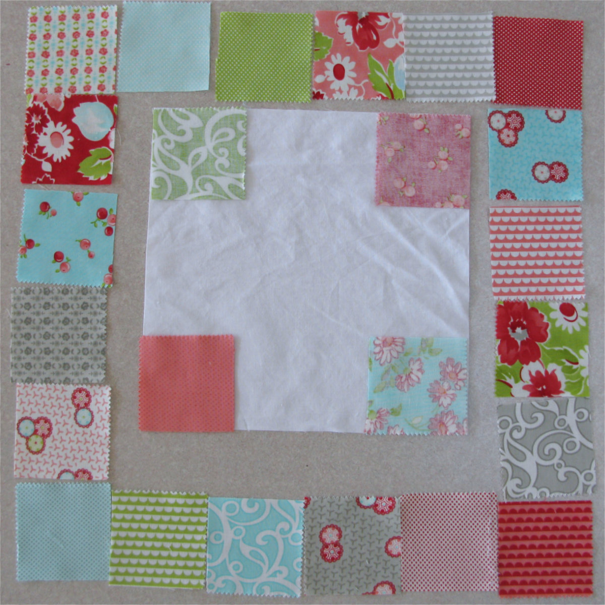 Cut the charm squares into 2 1/2 inch squares
