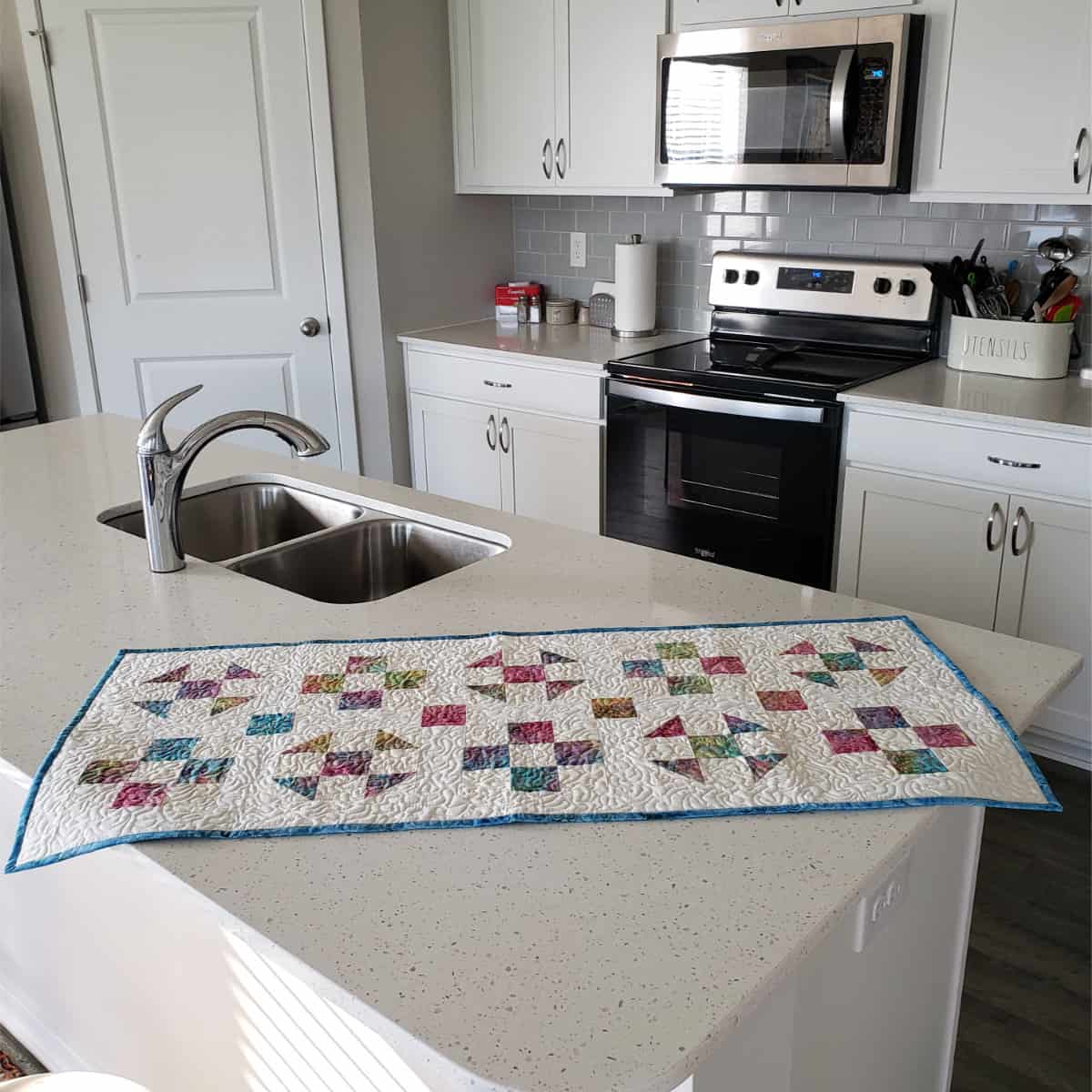 Shoo Fly and 9 Patch table runner on kitchen counter
