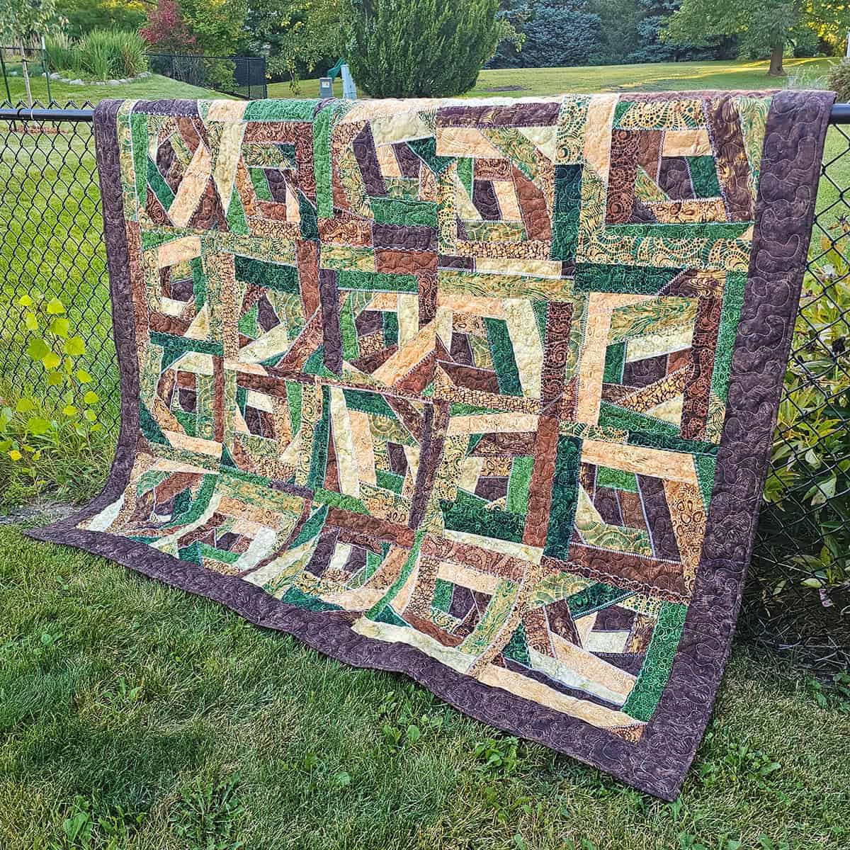 Crazy quilt on fence