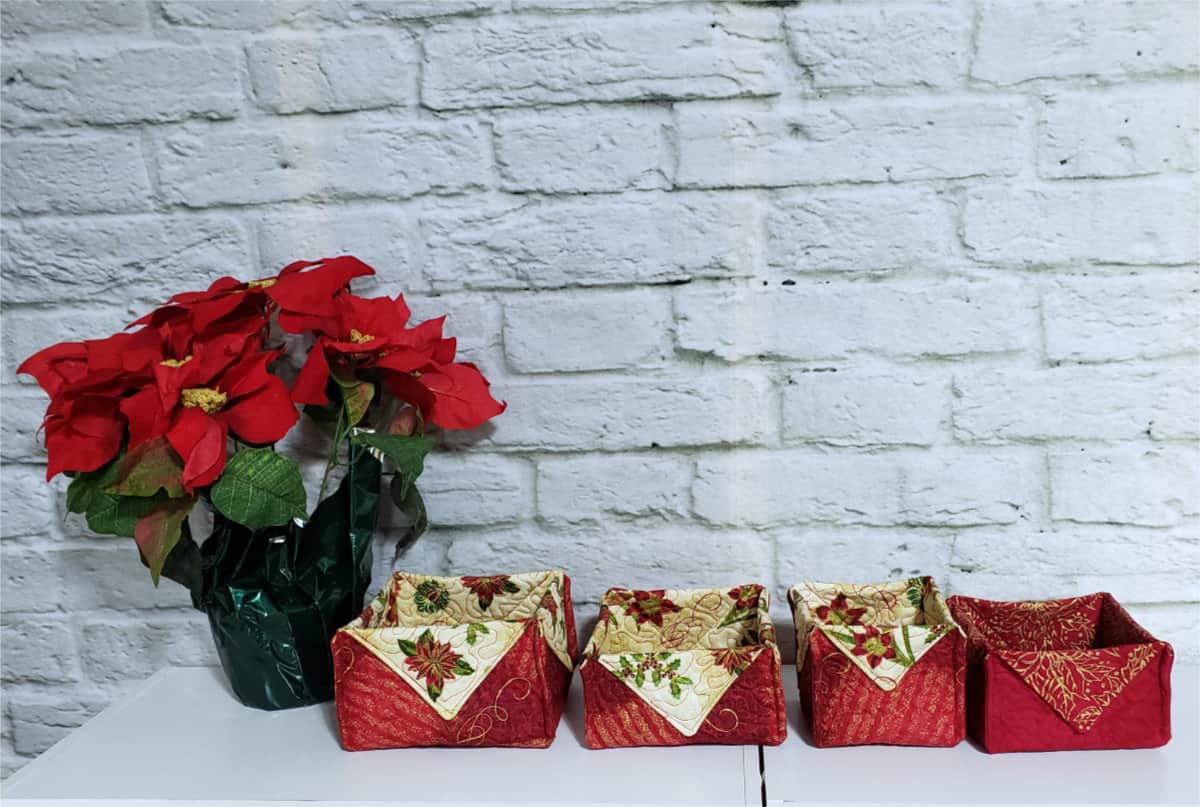 Christmas Fabric baskets on a table with flowers