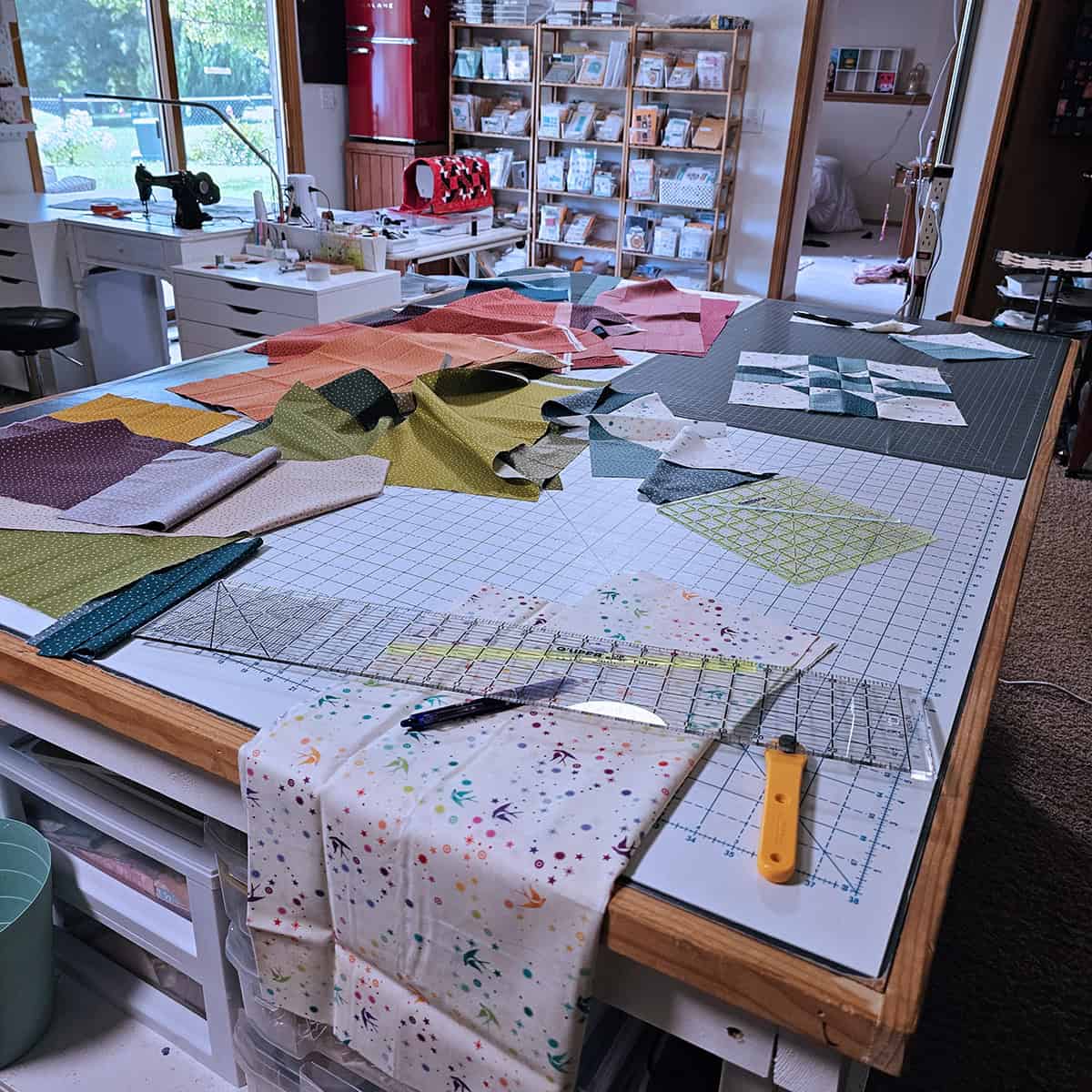 Messy quilt studio and cutting table