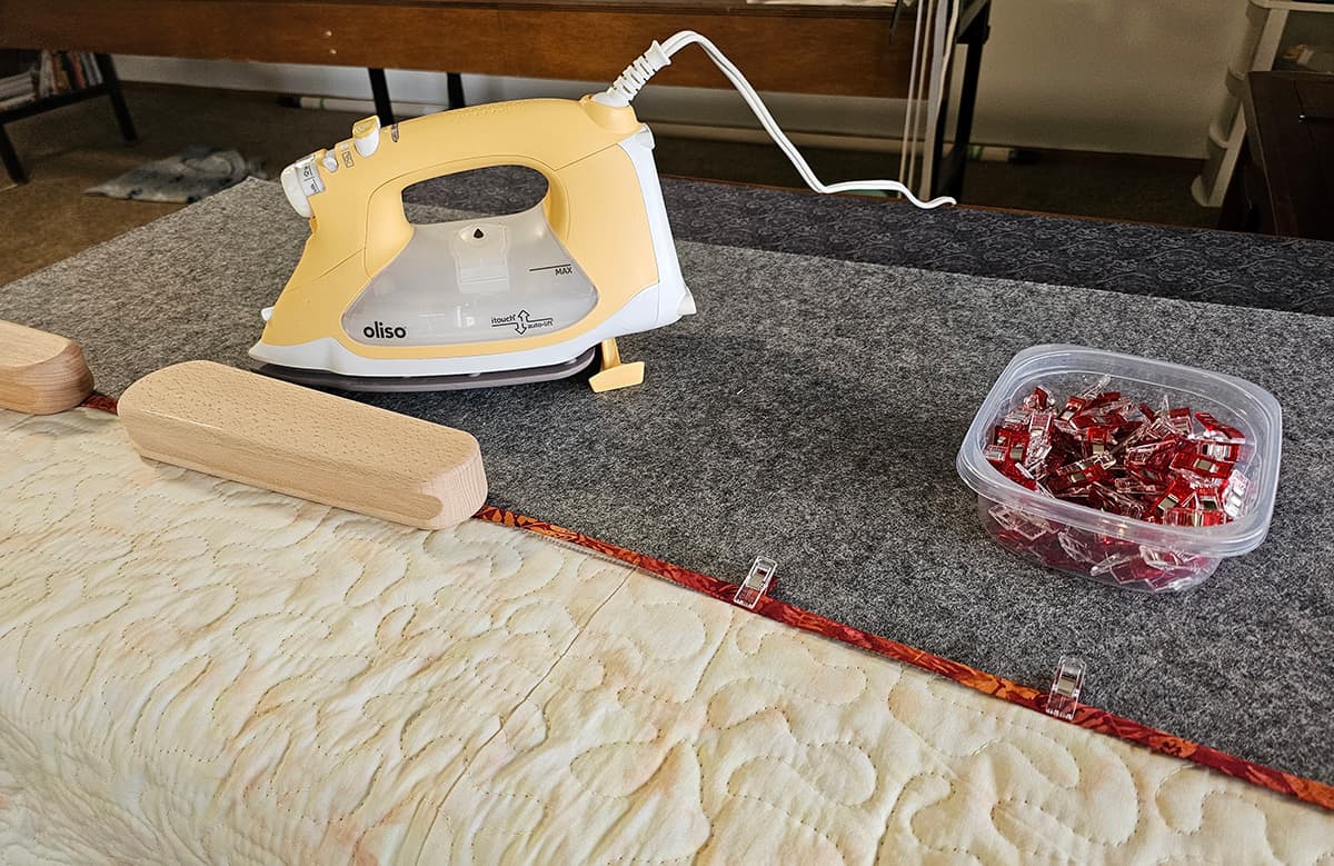 Oliso Iron and sewing the binding