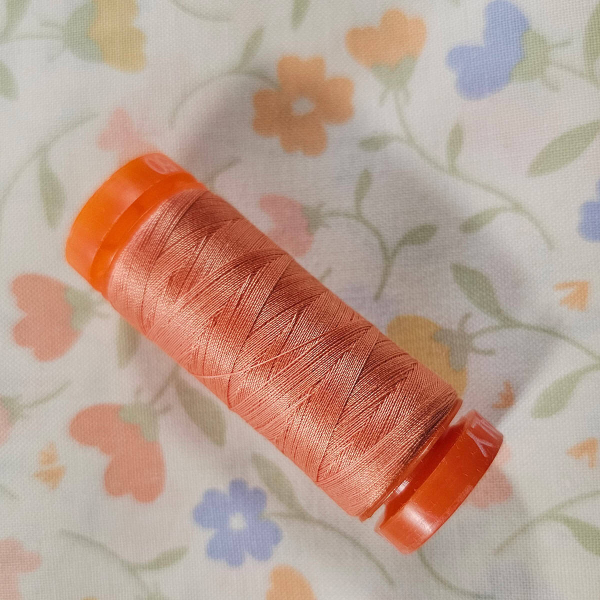 Orange Aurifil thread