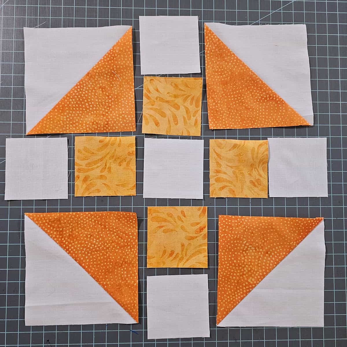Churn Dash quilt block sections