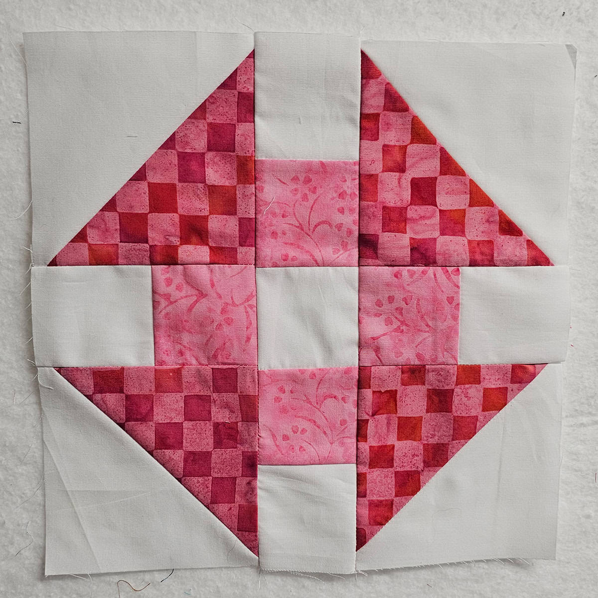 Pink Churn Dash quilt block