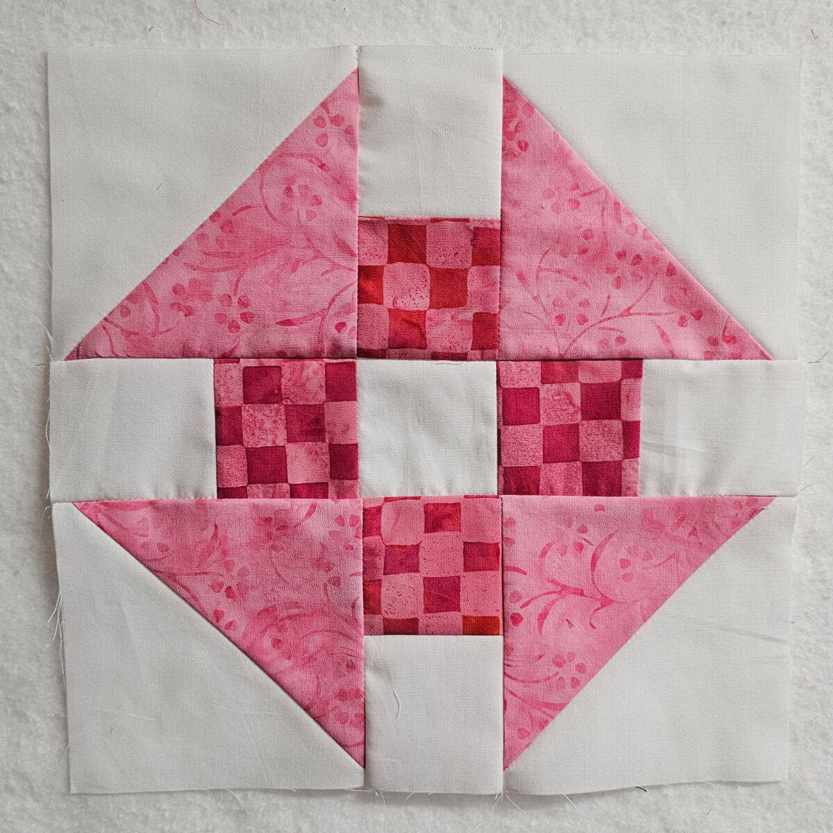 Pink Churn Dash quilt block