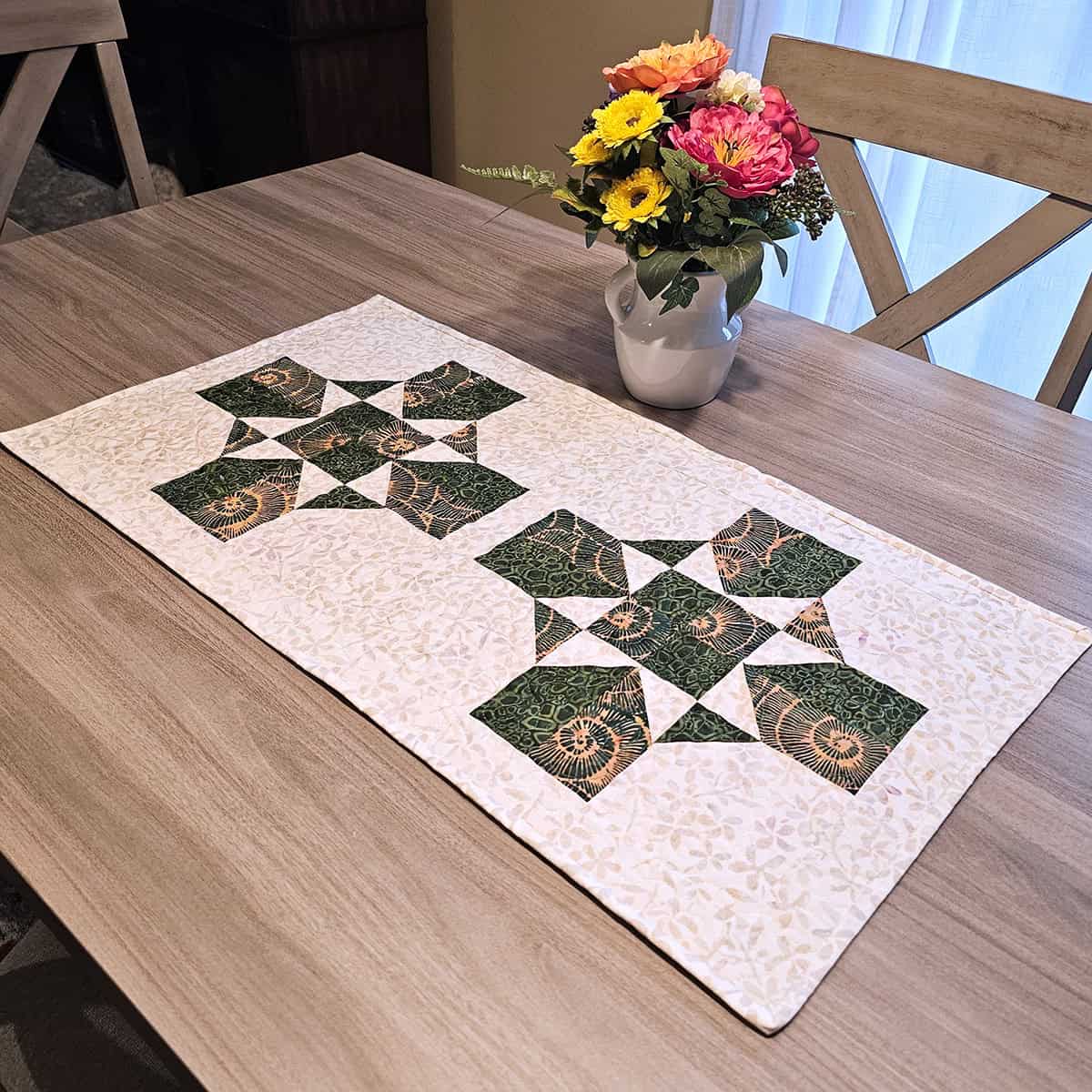 Earth Essence table runner with flowers