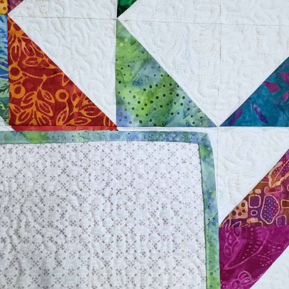 Binding on the quilt back